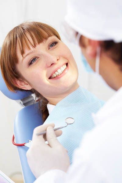 patient receiving dental care at Pacific Coast Dentistry in Paso Robles, CA