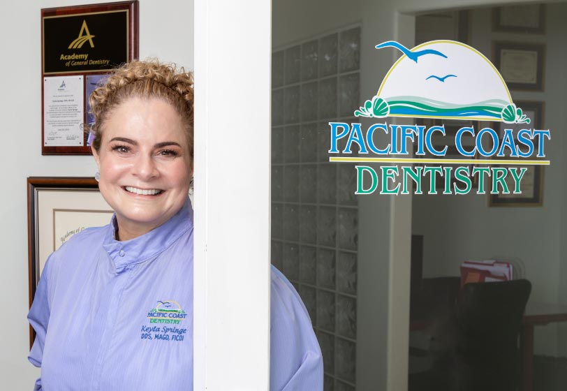 Paso Robles dentist Dr. Keyla Springe standing in the front door of her office Pacific Coast Dentistry